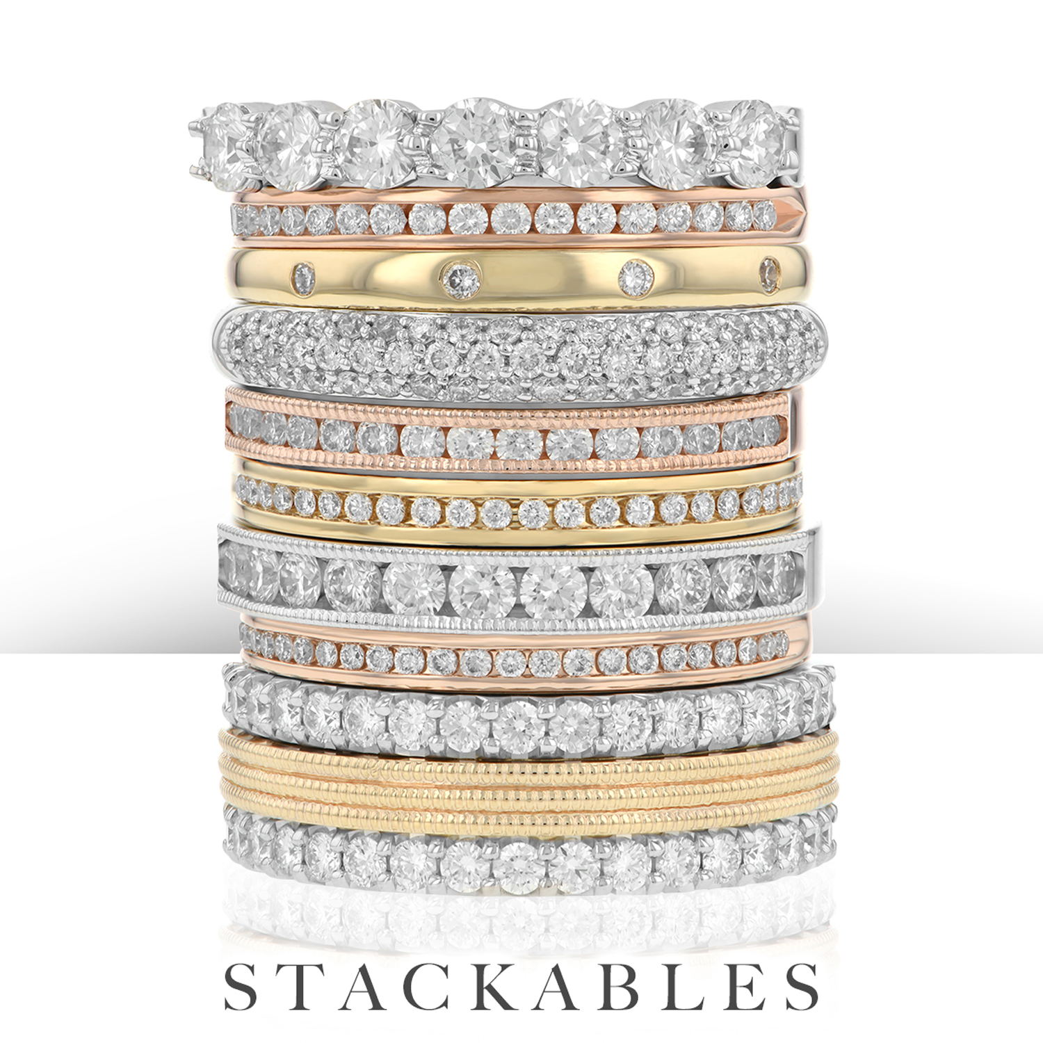 Stack of white, yellow, and rose gold diamond bands
